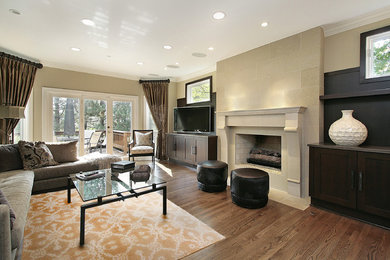 Mid-sized elegant medium tone wood floor family room photo in DC Metro with beige walls, a standard fireplace, a concrete fireplace and a corner tv