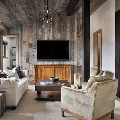 Example of a mountain style open concept medium tone wood floor and brown floor family room design in Other with brown walls, no fireplace and a wall-mounted tv