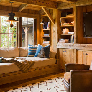 Inspiration for a rustic family room remodel in Other with a media wall