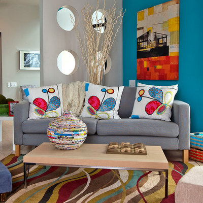 Example of a trendy light wood floor family room design in Austin with multicolored walls