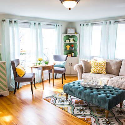 Example of a mid-sized classic open concept medium tone wood floor family room design in Austin with gray walls