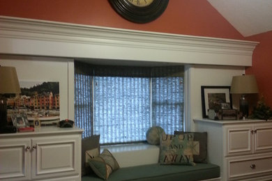 Example of a large classic open concept carpeted game room design in Indianapolis with orange walls