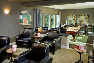 This is an example of a traditional enclosed games room in Orlando with grey walls, dark hardwood flooring and no fireplace.
