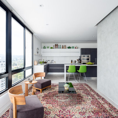 Example of a small trendy open concept carpeted family room design in Los Angeles with white walls and no tv