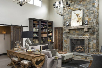 Example of a mountain style family room design in Other with a standard fireplace and a stone fireplace