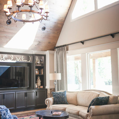 Family room - rustic enclosed dark wood floor and red floor family room idea in Other with white walls, no fireplace and a media wall