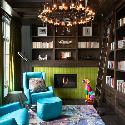 Inspiration for a large eclectic enclosed dark wood floor and brown floor family room library remodel in Calgary with a standard fireplace, a tile fireplace and gray walls