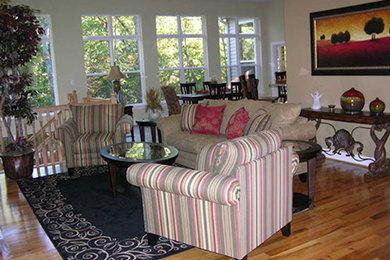 Example of a trendy open concept medium tone wood floor family room design in St Louis