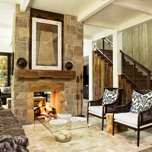 Family room - rustic family room idea in Atlanta with a stone fireplace