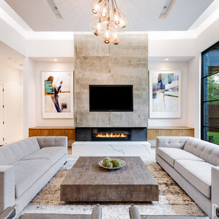 Family room - mid-sized contemporary light wood floor family room idea in Dallas with white walls, a ribbon fireplace and a wall-mounted tv
