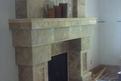 Large mountain style game room photo in Other with a standard fireplace and a tile fireplace