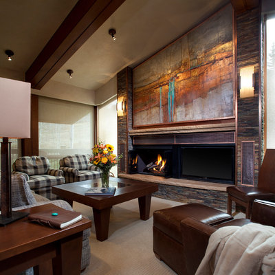 Family room - mid-sized contemporary enclosed carpeted family room idea in Denver with a standard fireplace, beige walls, a metal fireplace and a tv stand
