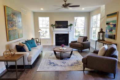 Large transitional open concept dark wood floor and brown floor family room photo in Philadelphia with beige walls, a standard fireplace, a wood fireplace surround and a wall-mounted tv