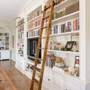 Example of a huge classic open concept medium tone wood floor family room library design in Other with gray walls, a standard fireplace, a tile fireplace and a tv stand