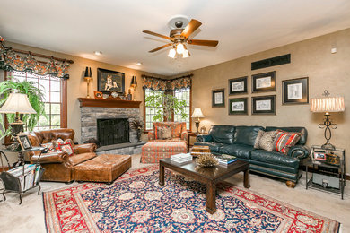Large elegant open concept carpeted family room photo in Philadelphia with multicolored walls, a standard fireplace, a stone fireplace and a concealed tv