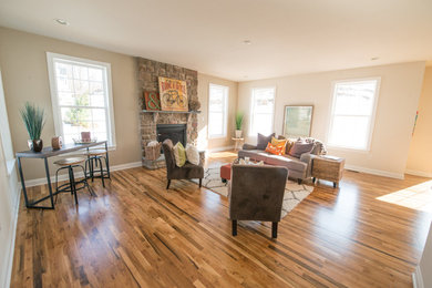 Mid-sized transitional open concept medium tone wood floor and brown floor family room photo in Philadelphia with beige walls, no fireplace and no tv