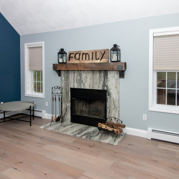 Transitional Fantasy Brown Quartzite Fireplace Surround with French Oak Flooring