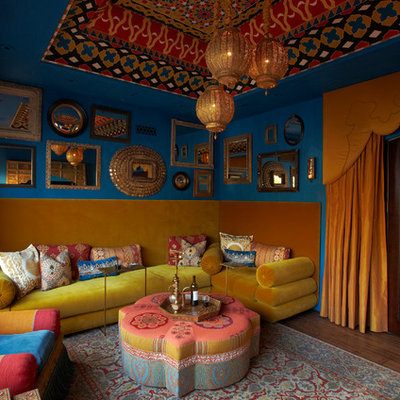 Inspiration for a mediterranean enclosed dark wood floor family room remodel in Phoenix with blue walls, no fireplace and no tv