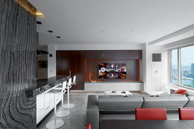 This is an example of a large classic enclosed games room in New York with a concealed tv, white walls, ceramic flooring, a standard fireplace and grey floors.