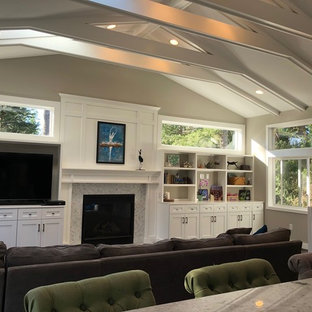 Family room - mid-sized transitional enclosed dark wood floor and brown floor family room idea in Seattle with beige walls, a standard fireplace, a tile fireplace and a tv stand