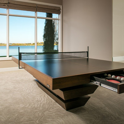 Game room - large transitional open concept carpeted and beige floor game room idea in Omaha with brown walls and no fireplace