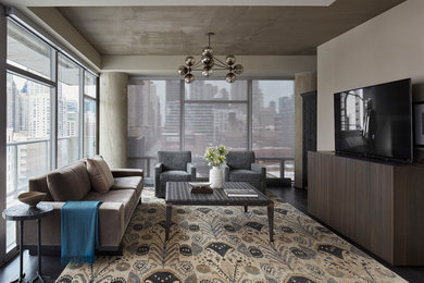 Photo of a large contemporary enclosed games room in Chicago with a freestanding tv, grey walls, dark hardwood flooring, no fireplace and black floors.