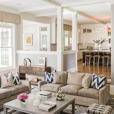 Example of a large transitional open concept medium tone wood floor and brown floor family room design in Boston with gray walls and no tv
