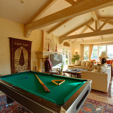 Vaulted ceiling family room with a pool table