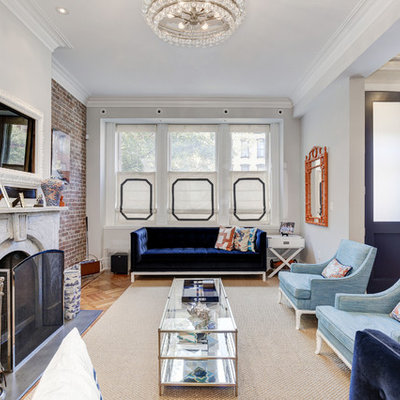 Inspiration for a victorian open concept light wood floor family room remodel in Seattle with gray walls, a standard fireplace and a wall-mounted tv