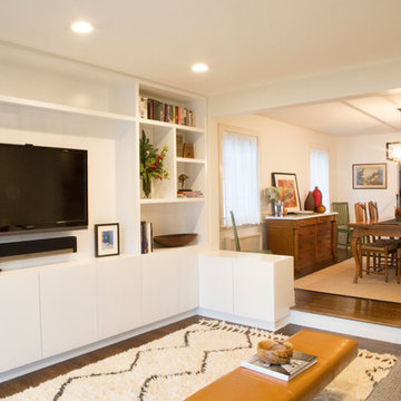 View of modern, custom cabinets in family room.