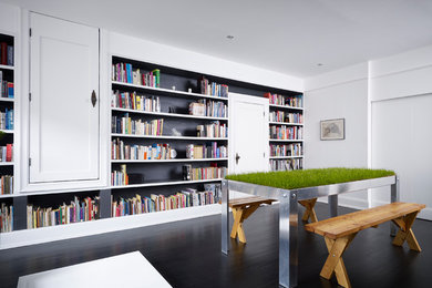 Example of a trendy family room design in New York with white walls