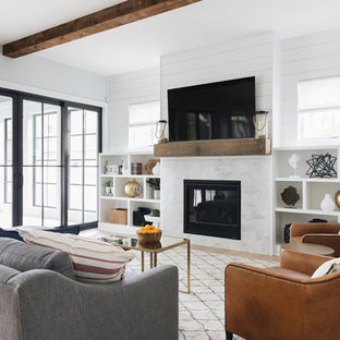 Beach style light wood floor family room photo in Chicago with white walls and a wall-mounted tv