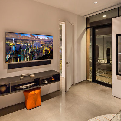 Large trendy enclosed concrete floor and gray floor family room photo in Phoenix with white walls, a music area, no fireplace and a wall-mounted tv