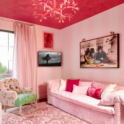Eclectic family room photo in New York with pink walls and a wall-mounted tv