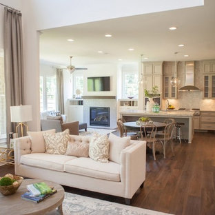 Mid-sized elegant open concept dark wood floor family room library photo in Atlanta with beige walls, a standard fireplace, a stone fireplace and a tv stand