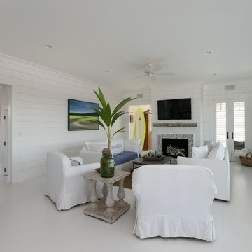 White Family Room - Wood Walls - Family Space -  White Floor - Blue Front Door