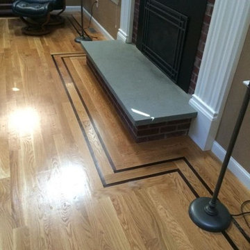 White Oak hardwood floor that has a 1″ walnut feature strip