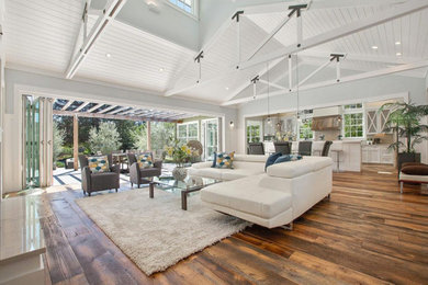 Inspiration for a farmhouse medium tone wood floor family room remodel in San Francisco