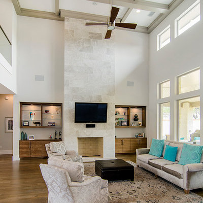 Inspiration for a contemporary open concept medium tone wood floor family room remodel in Dallas with a standard fireplace and a wall-mounted tv