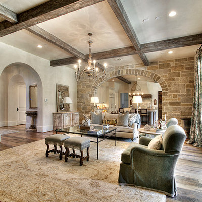 Family room - traditional medium tone wood floor family room idea in Houston with beige walls