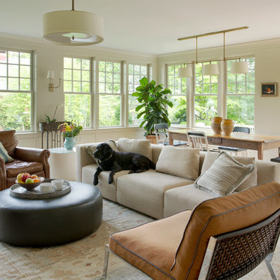 Inspiration for a mid-sized victorian open concept light wood floor family room remodel in Boston with beige walls and no tv