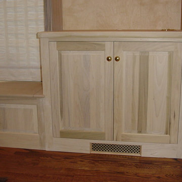 Window seat cabinet with Base cabinets and book shelves.