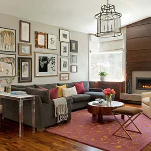 Inspiration for a large contemporary dark wood floor and gray floor family room remodel in San Francisco with a wood fireplace surround, gray walls and a ribbon fireplace