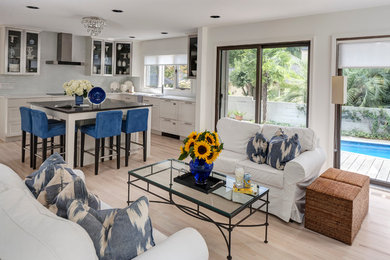 Family room - mid-sized contemporary open concept light wood floor family room idea in Atlanta with white walls, a standard fireplace and a stone fireplace