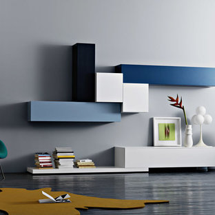 Minimalist painted wood floor family room library photo in New York with gray walls