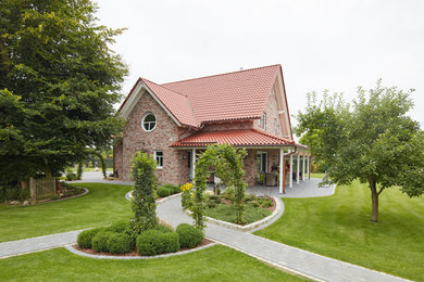 Immagine di un giardino country esposto in pieno sole di medie dimensioni e dietro casa