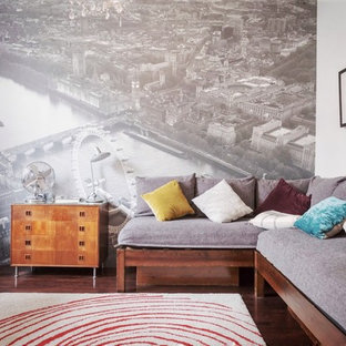 Design ideas for a contemporary games room in Sussex with white walls, medium hardwood flooring and brown floors.