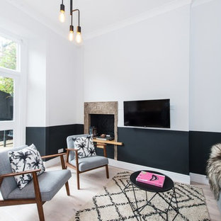 Design ideas for a scandinavian games room in Edinburgh with multi-coloured walls, light hardwood flooring and a wall mounted tv.