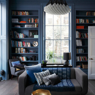 Inspiration for a bohemian enclosed games room in London with a reading nook, blue walls, dark hardwood flooring and grey floors.