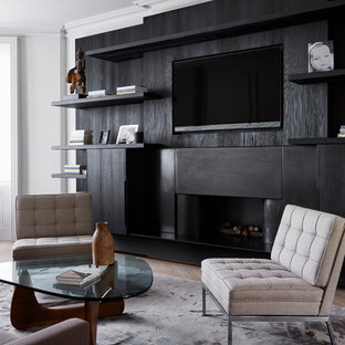 Design ideas for a contemporary games room in London with a ribbon fireplace and a wall mounted tv.